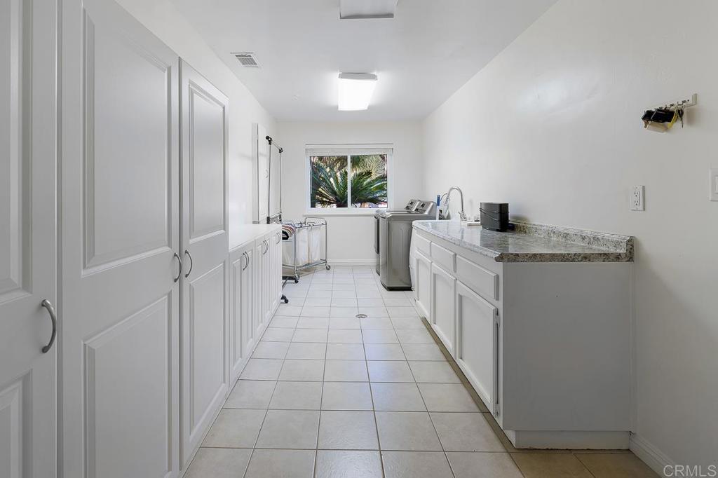 14062 Jamacha Hills Road Jamul, CA 91935 - Photo 21 of 39 a kitchen with white cabinets