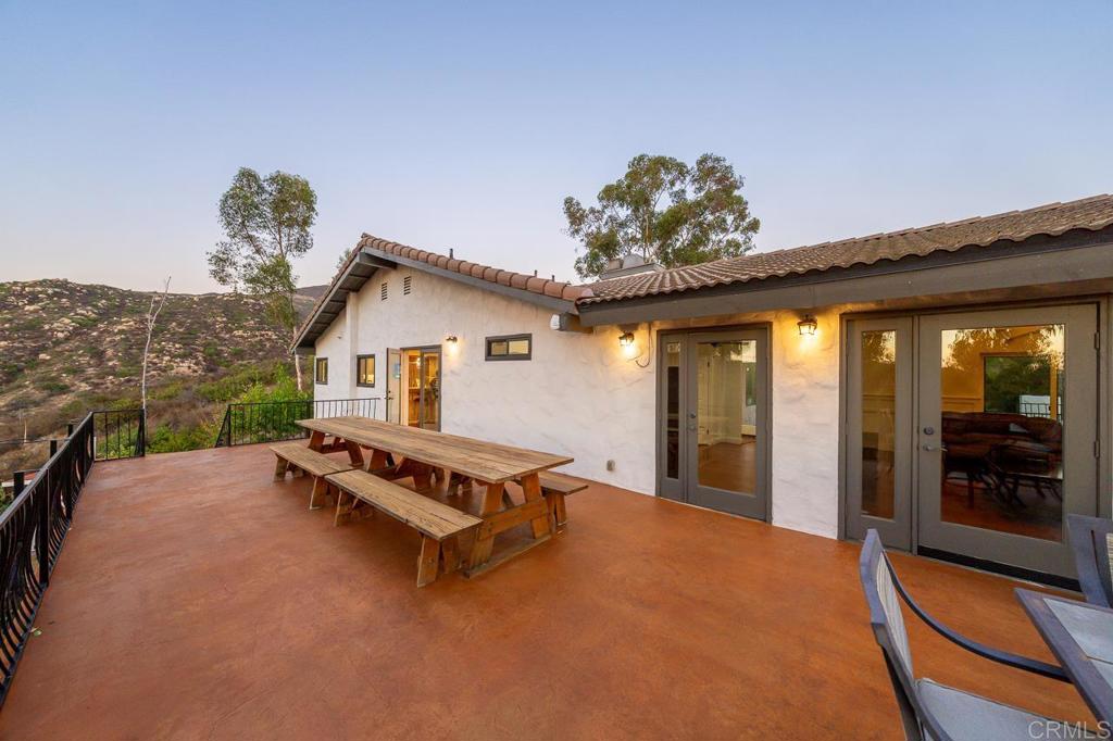 14062 Jamacha Hills Road Jamul, CA 91935 - Photo 23 of 39 a view of a terrace with a table and chairs