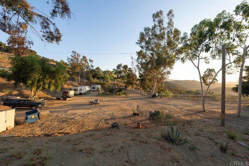 14062 Jamacha Hills Road Jamul, CA 91935 - Photo 36 of 39 a view of dirt yard with large trees