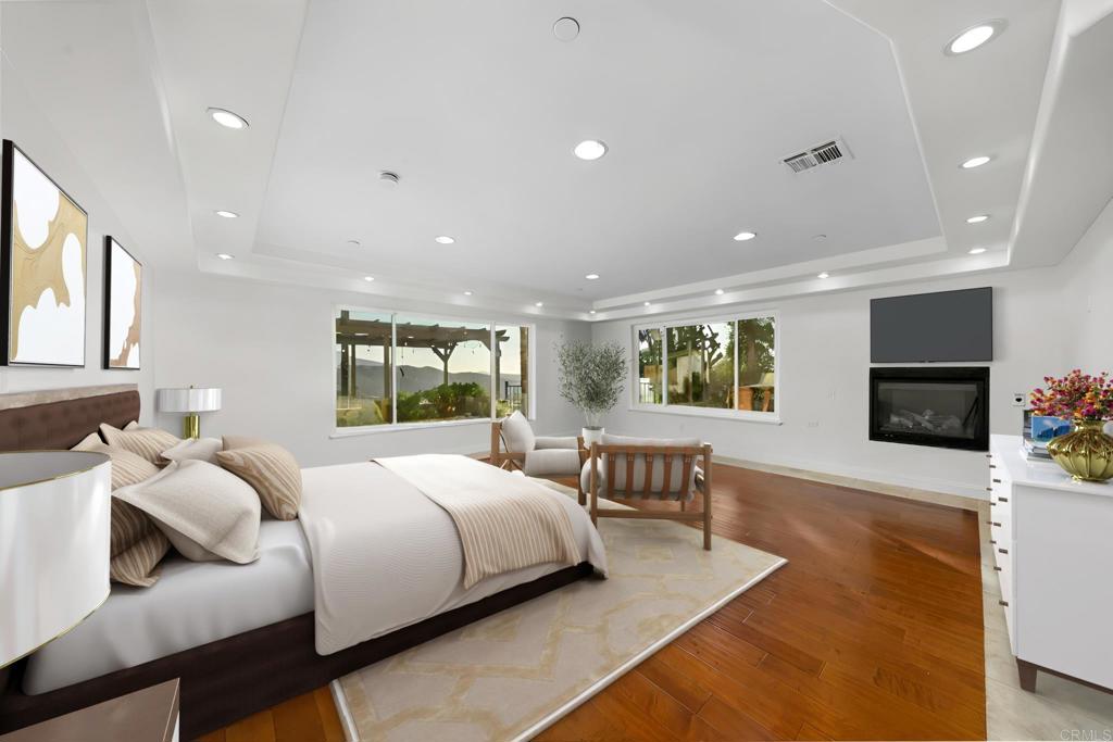 14062 Jamacha Hills Road Jamul, CA 91935 - Photo 7 of 39 a bedroom with a bed and a flat screen tv