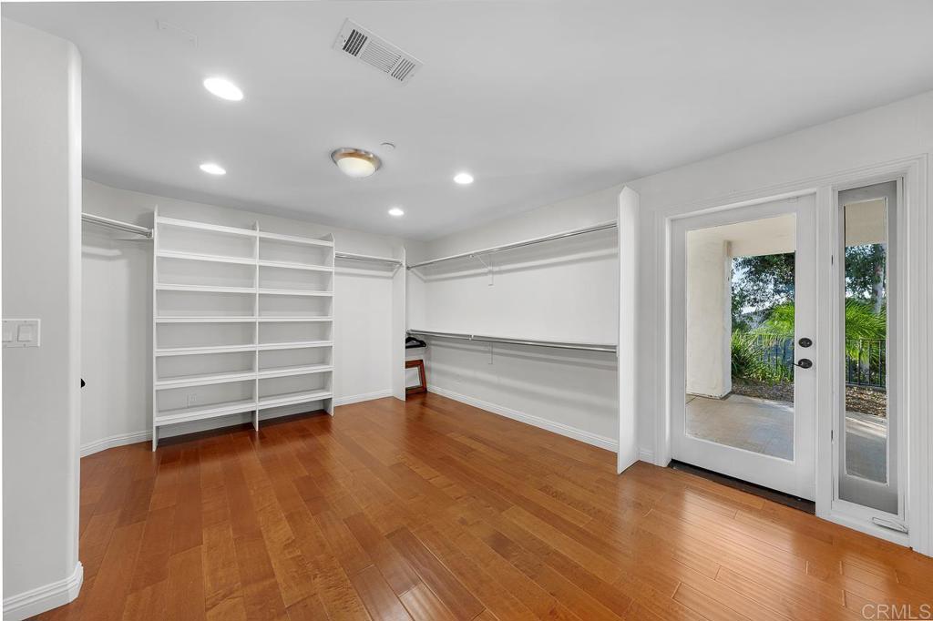 14062 Jamacha Hills Road Jamul, CA 91935 - Photo 8 of 39 an empty room with wooden floor and a window