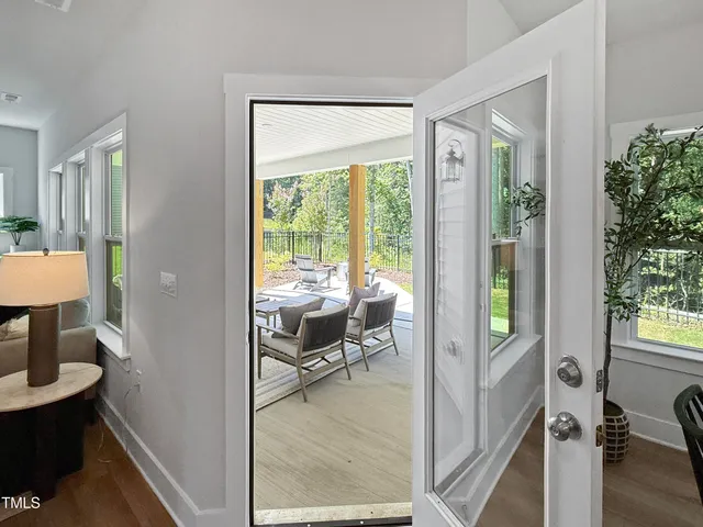 a view of a livingroom with furniture and front door