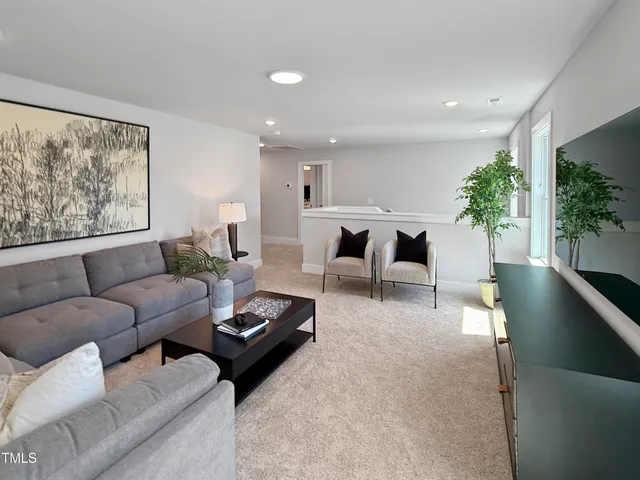 a bedroom with bed lamp and window