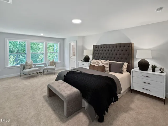 a bedroom with bed and window