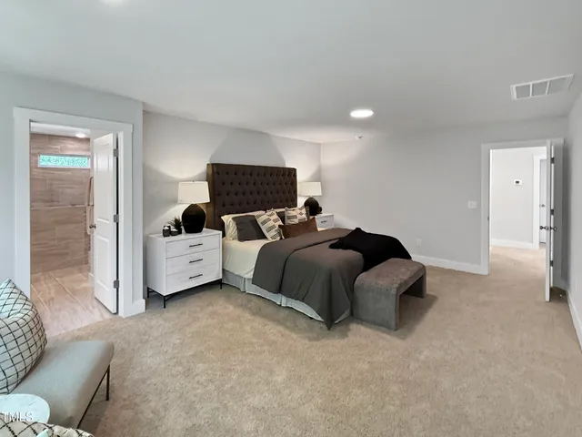 a bedroom with a bed and couch