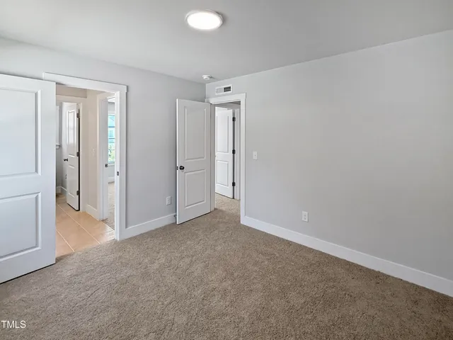 a white toilet sitting next to a bath tub shower