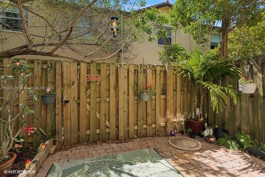 9165 Southwest 227th Street, Unit 5 Cutler Bay, FL 33190 - Photo 13 of 26 a view of a backyard of the house