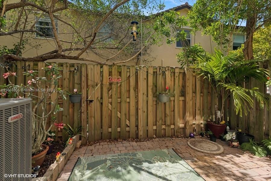 9165 Southwest 227th Street, Unit 5 Cutler Bay, FL 33190 - Photo 14 of 26 a view of a backyard of the house