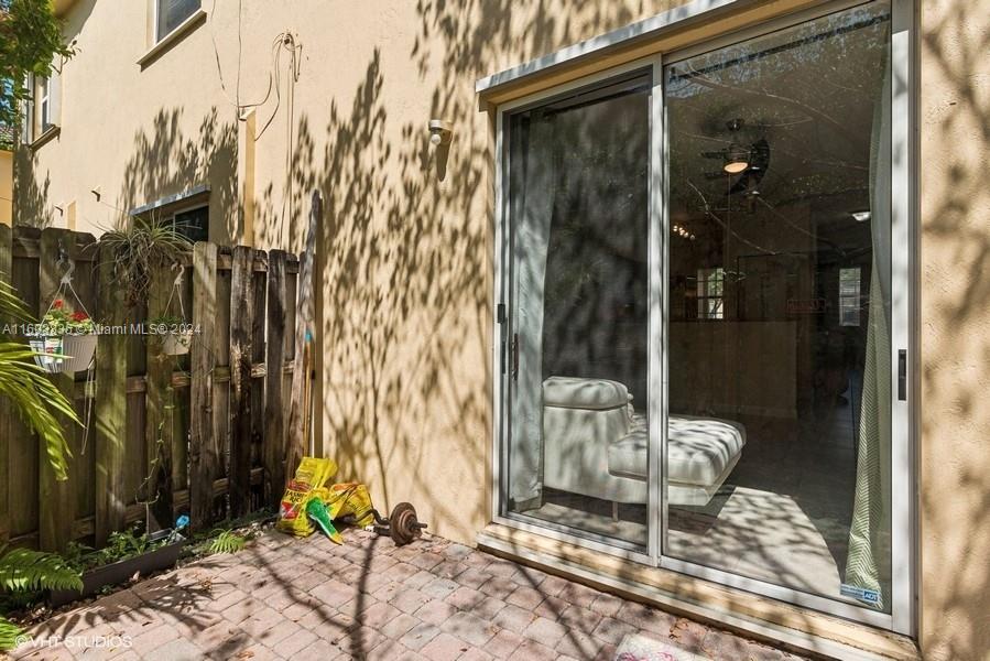 9165 Southwest 227th Street, Unit 5 Cutler Bay, FL 33190 - Photo 16 of 26 a view of a porch with a backyard