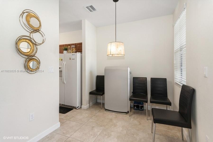 9165 Southwest 227th Street, Unit 5 Cutler Bay, FL 33190 - Photo 22 of 26 a view of kitchen with furniture and a window