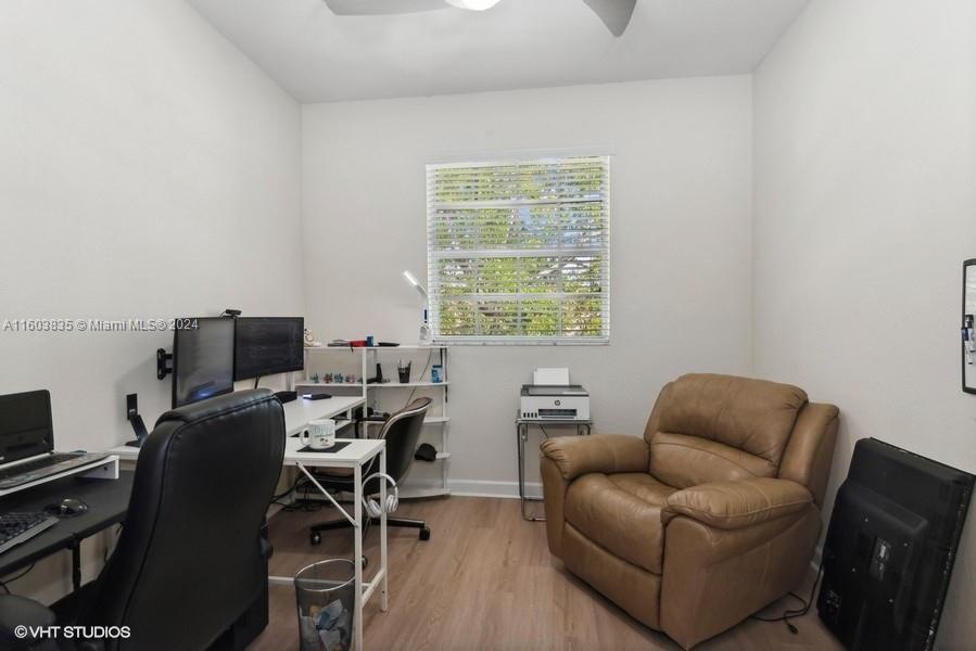 9165 Southwest 227th Street, Unit 5 Cutler Bay, FL 33190 - Photo 7 of 26 a work room with furniture and a window
