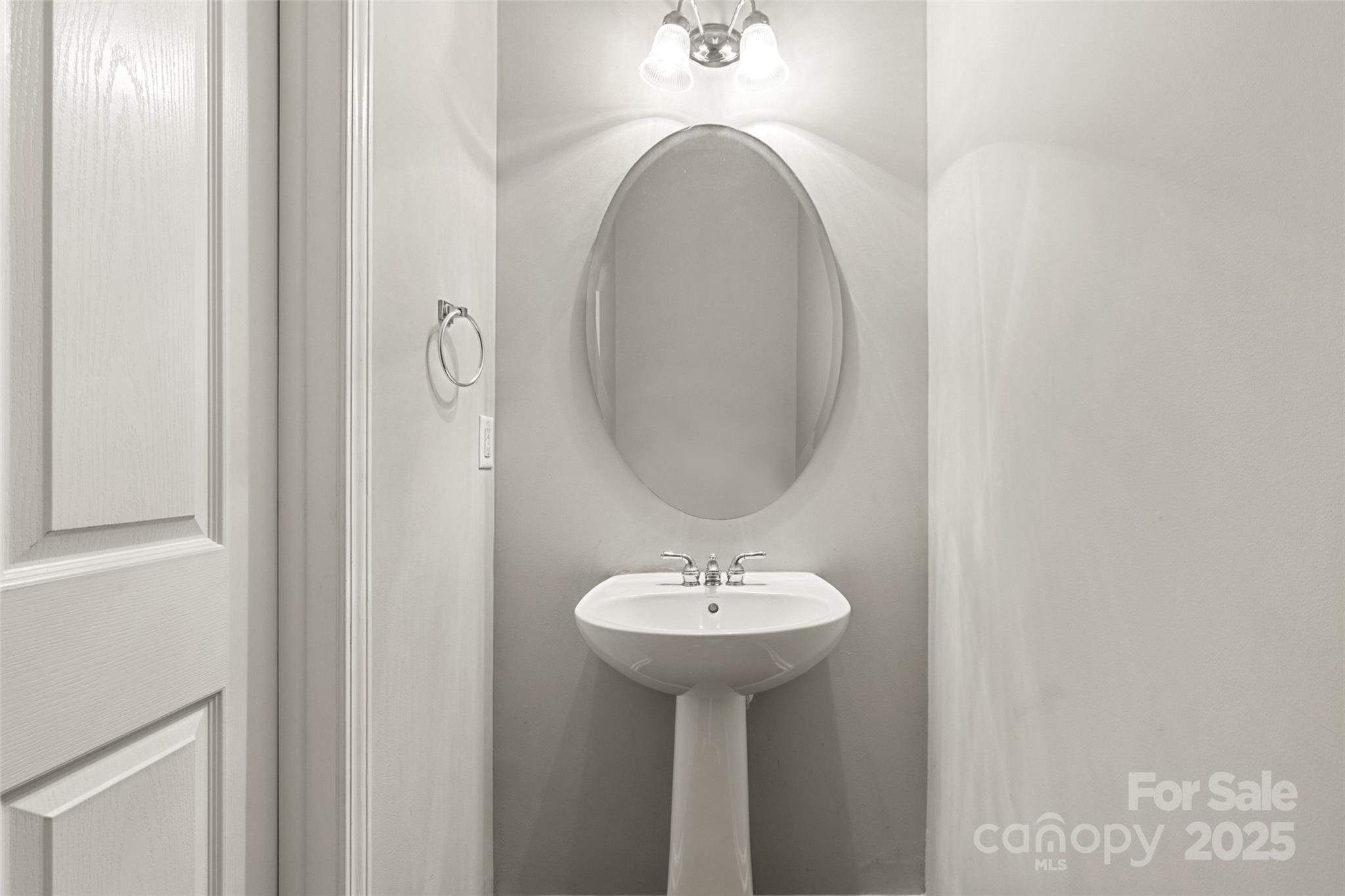 719 Deerbrook Lane Tega Cay, SC 29708 - Photo 11 of 33 a bathroom with a sink and a mirror