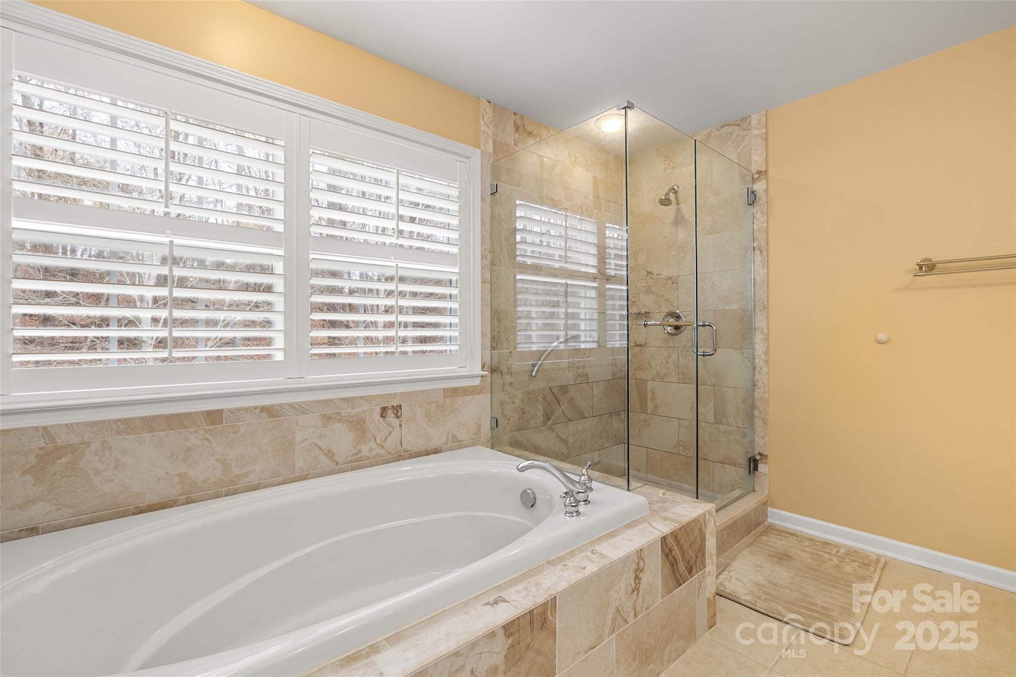719 Deerbrook Lane Tega Cay, SC 29708 - Photo 16 of 33 a bathroom with a bathtub and a shower