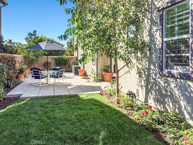a view of a backyard with sitting area