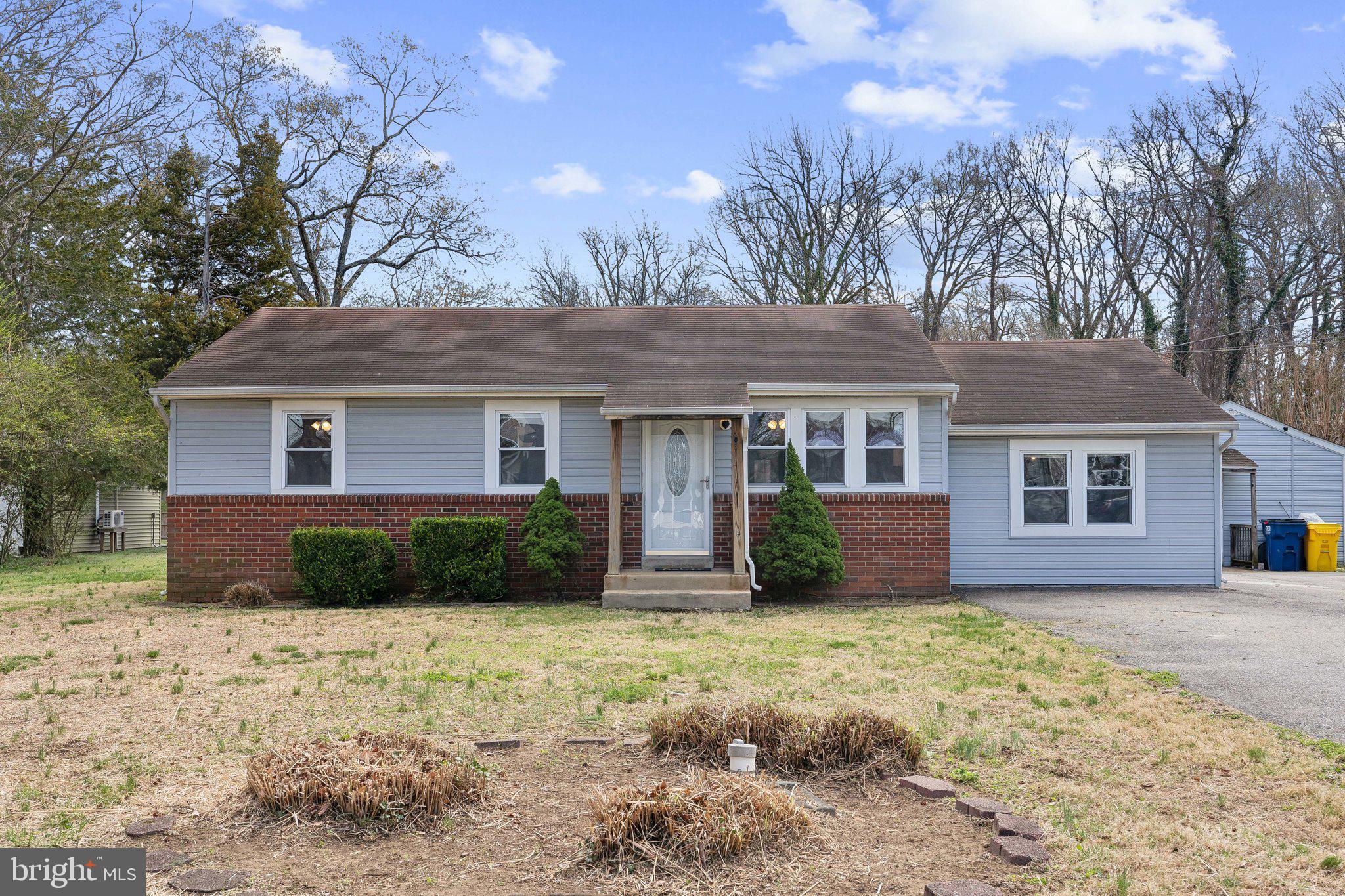 937 Winding Road Edgewater, MD 21037 - Photo 1 of 42 a front view of a house with a yard