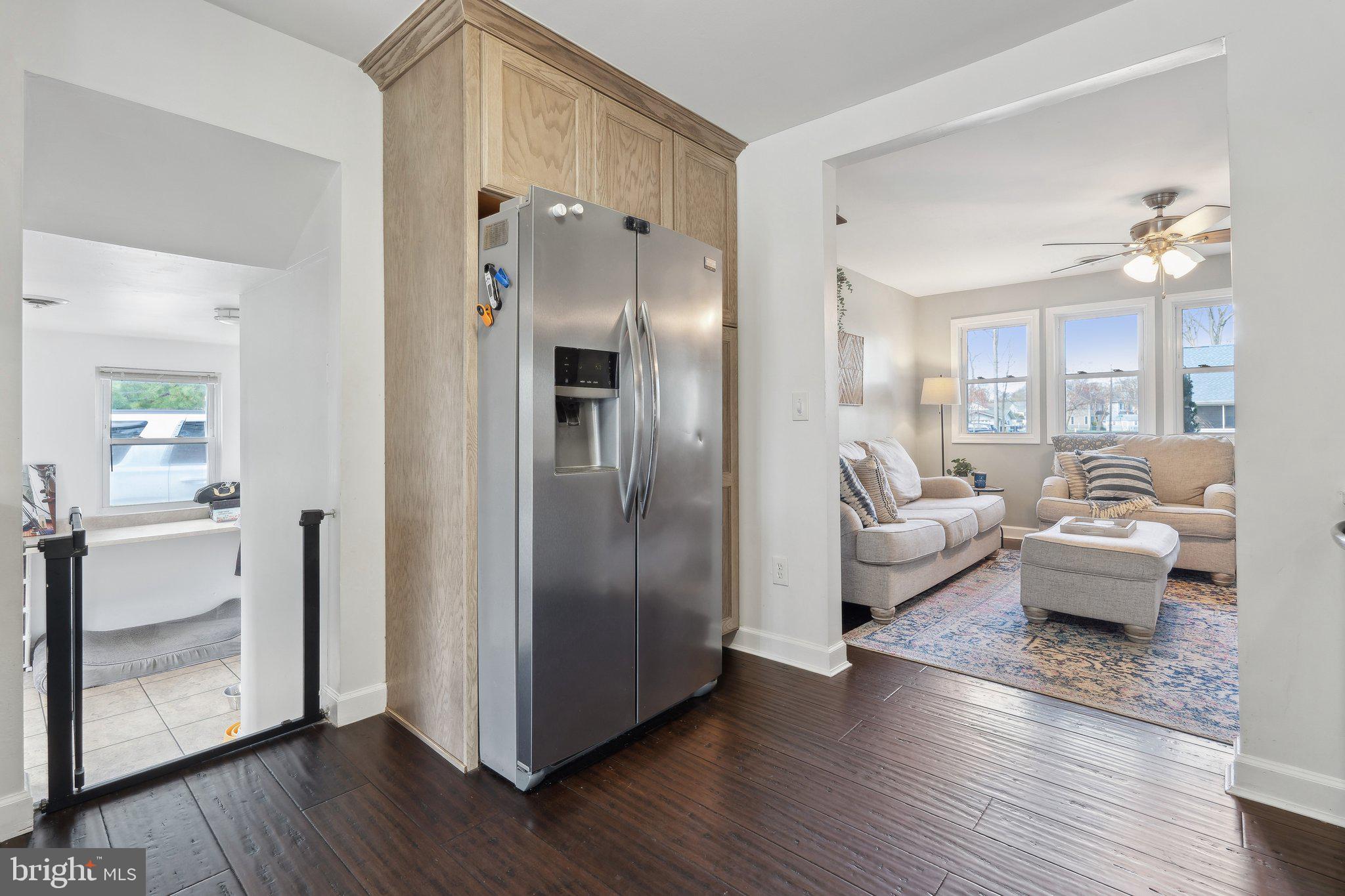 937 Winding Road Edgewater, MD 21037 - Photo 14 of 42 a living room with furniture and a wooden floor