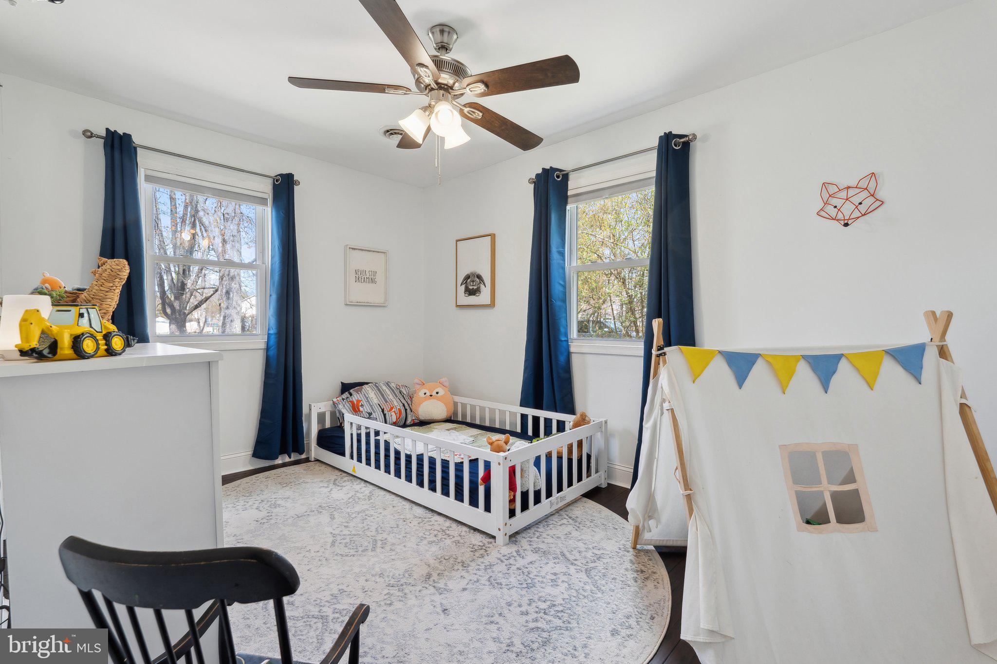 937 Winding Road Edgewater, MD 21037 - Photo 19 of 42 a bedroom with a bed and a window