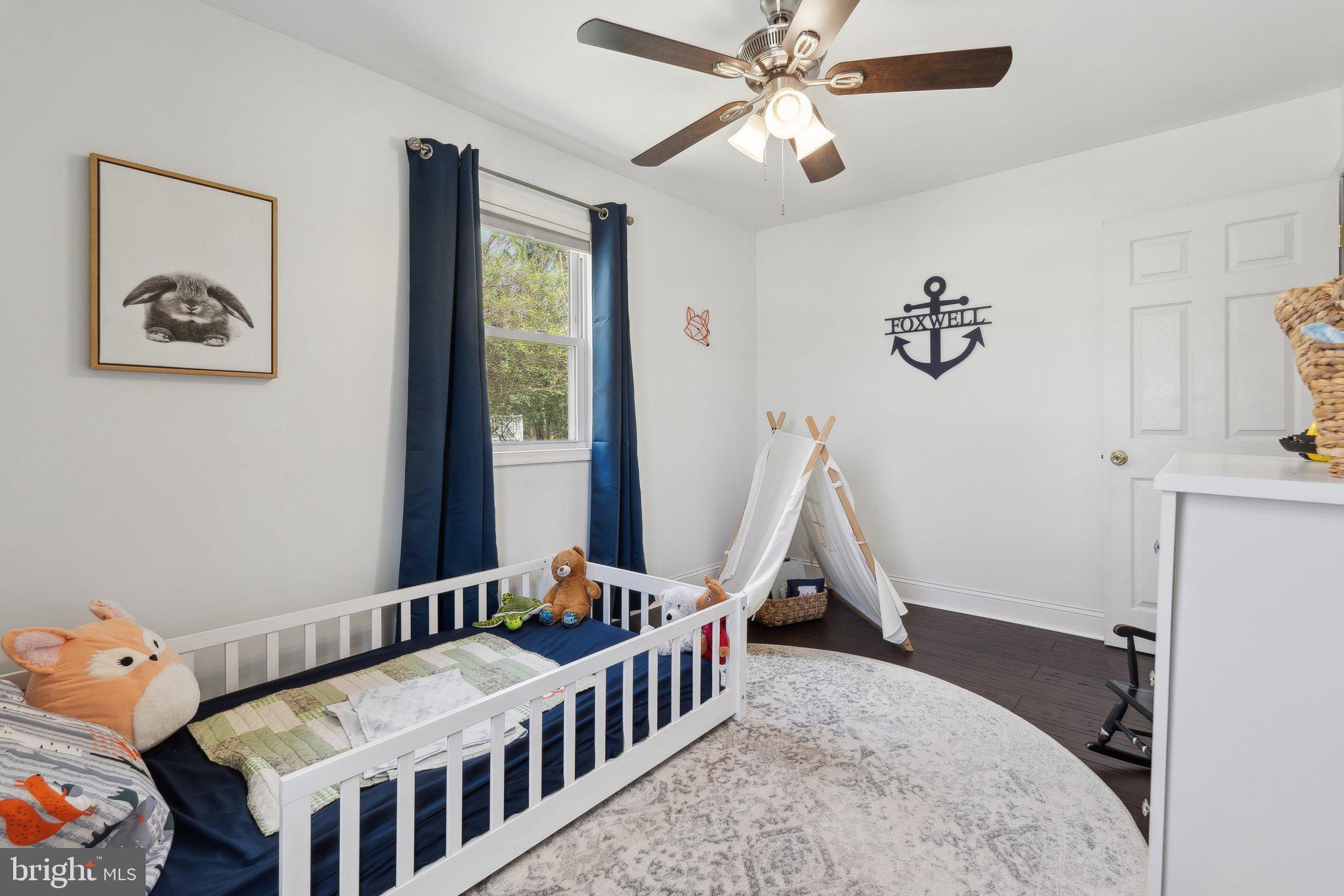 937 Winding Road Edgewater, MD 21037 - Photo 20 of 42 a bedroom with furniture and a window