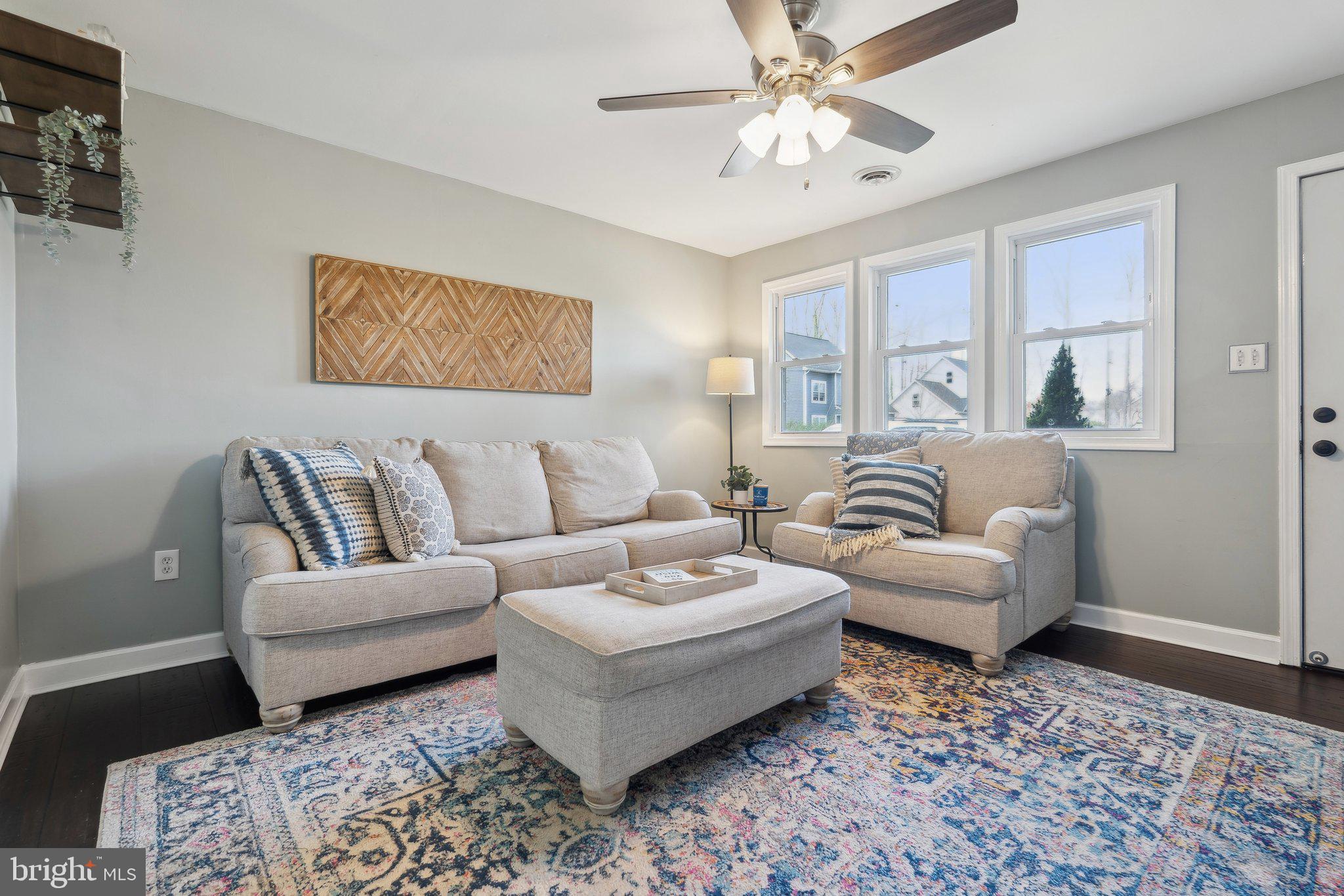 937 Winding Road Edgewater, MD 21037 - Photo 2 of 42 a living room with furniture and a rug