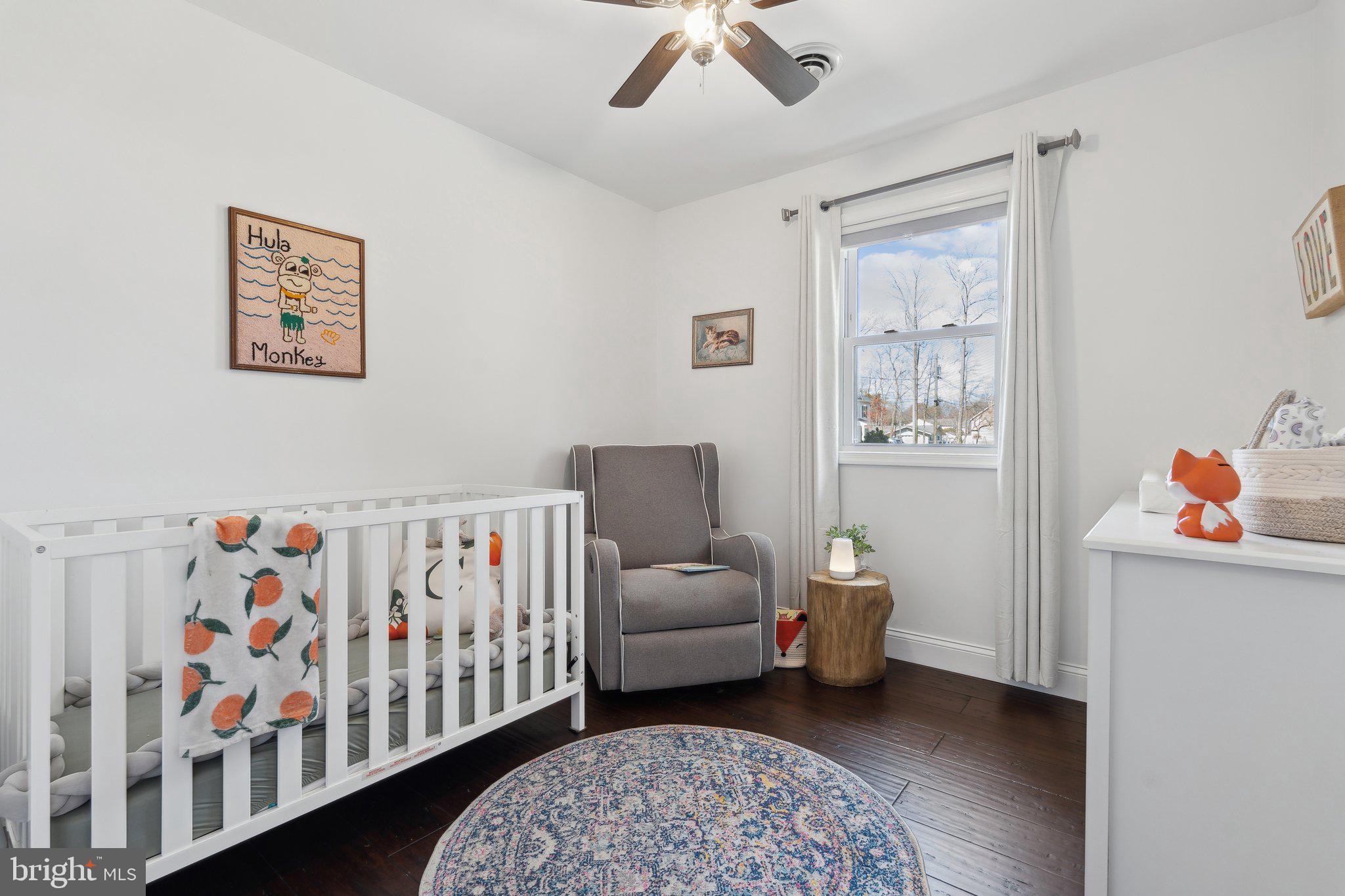 937 Winding Road Edgewater, MD 21037 - Photo 21 of 42 a bedroom with furniture and a rug
