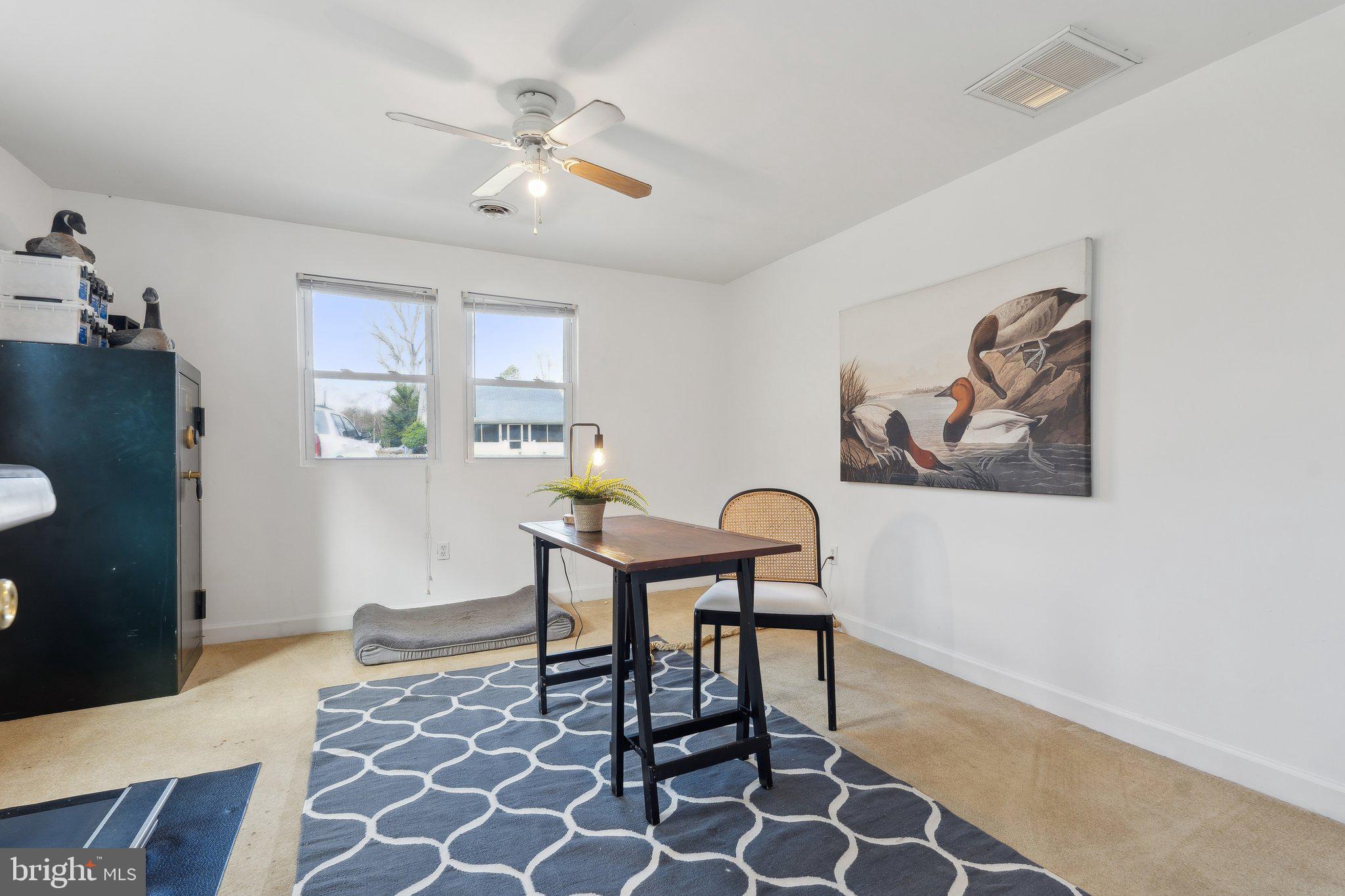 937 Winding Road Edgewater, MD 21037 - Photo 22 of 42 a view of a dining room with furniture