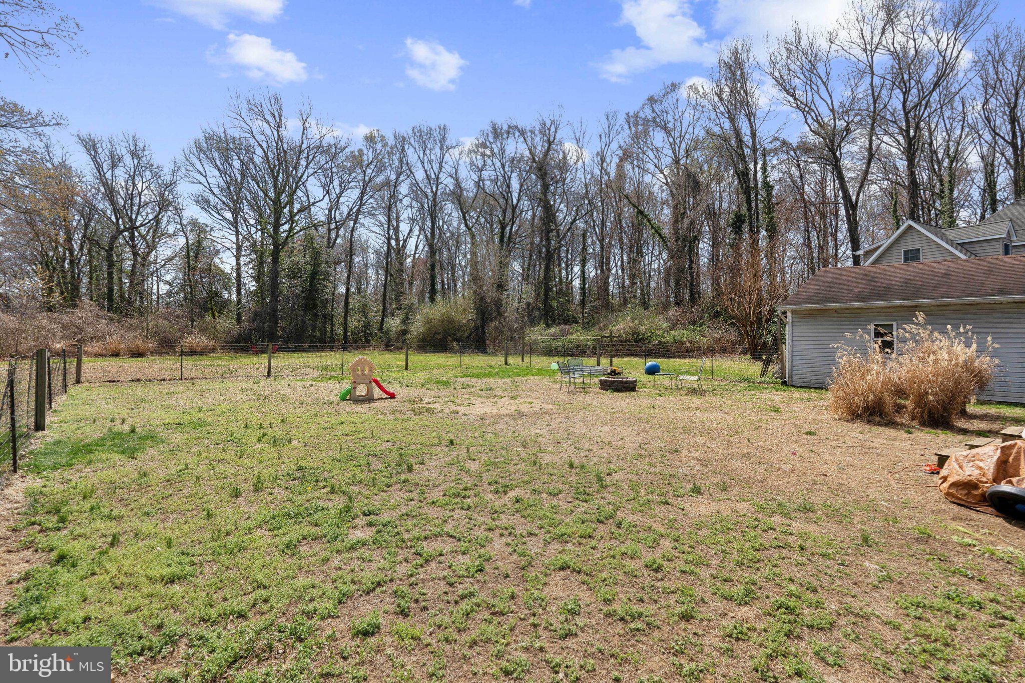 937 Winding Road Edgewater, MD 21037 - Photo 25 of 42 a backyard of a house with lots of green space and outdoor seating