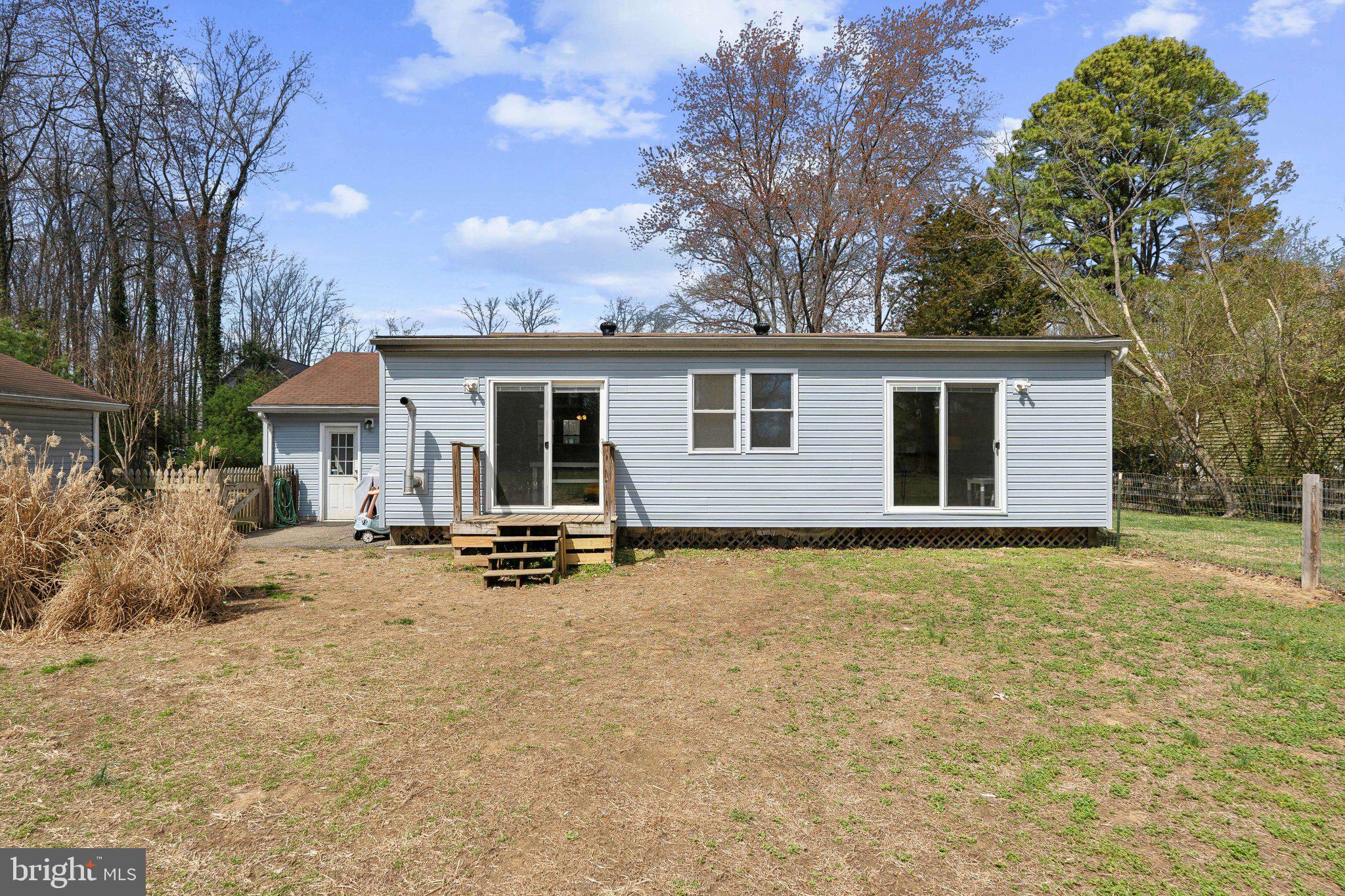 937 Winding Road Edgewater, MD 21037 - Photo 27 of 42 a view of a house with backyard and chairs