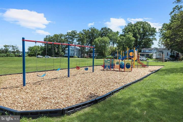 937 Winding Road Edgewater, MD 21037 - Photo 36 of 42 a view of a park with swings and slides