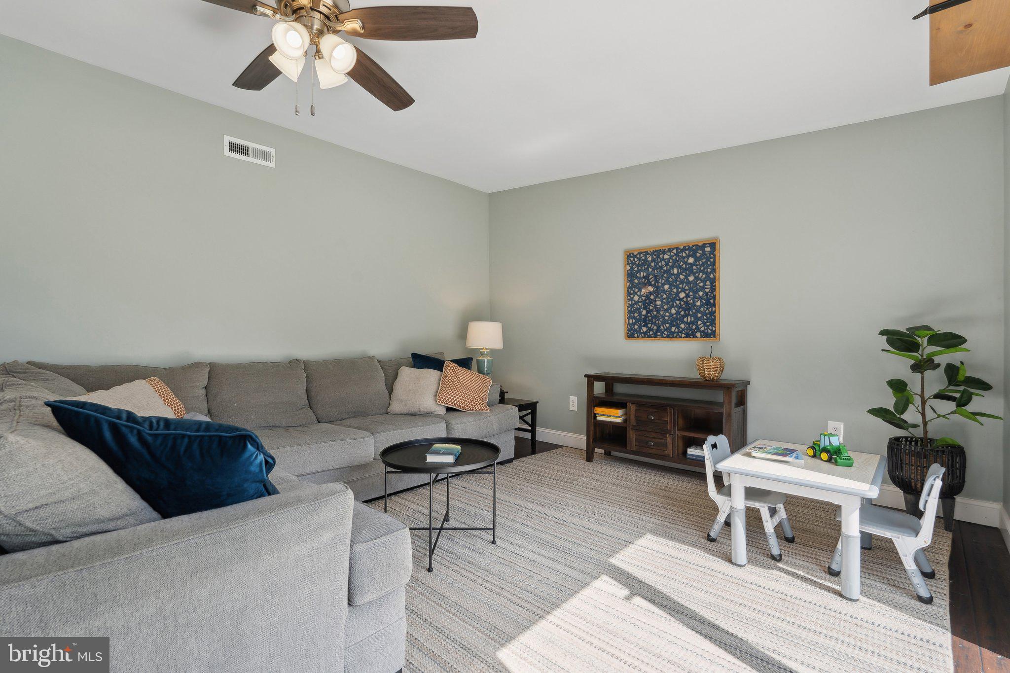 937 Winding Road Edgewater, MD 21037 - Photo 6 of 42 a living room with furniture and a rug