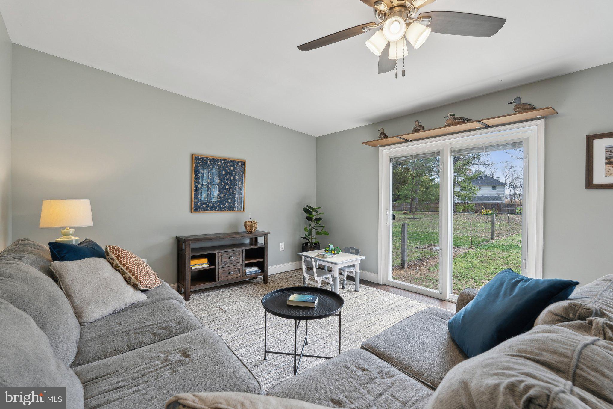 937 Winding Road Edgewater, MD 21037 - Photo 7 of 42 a living room with furniture and a large window