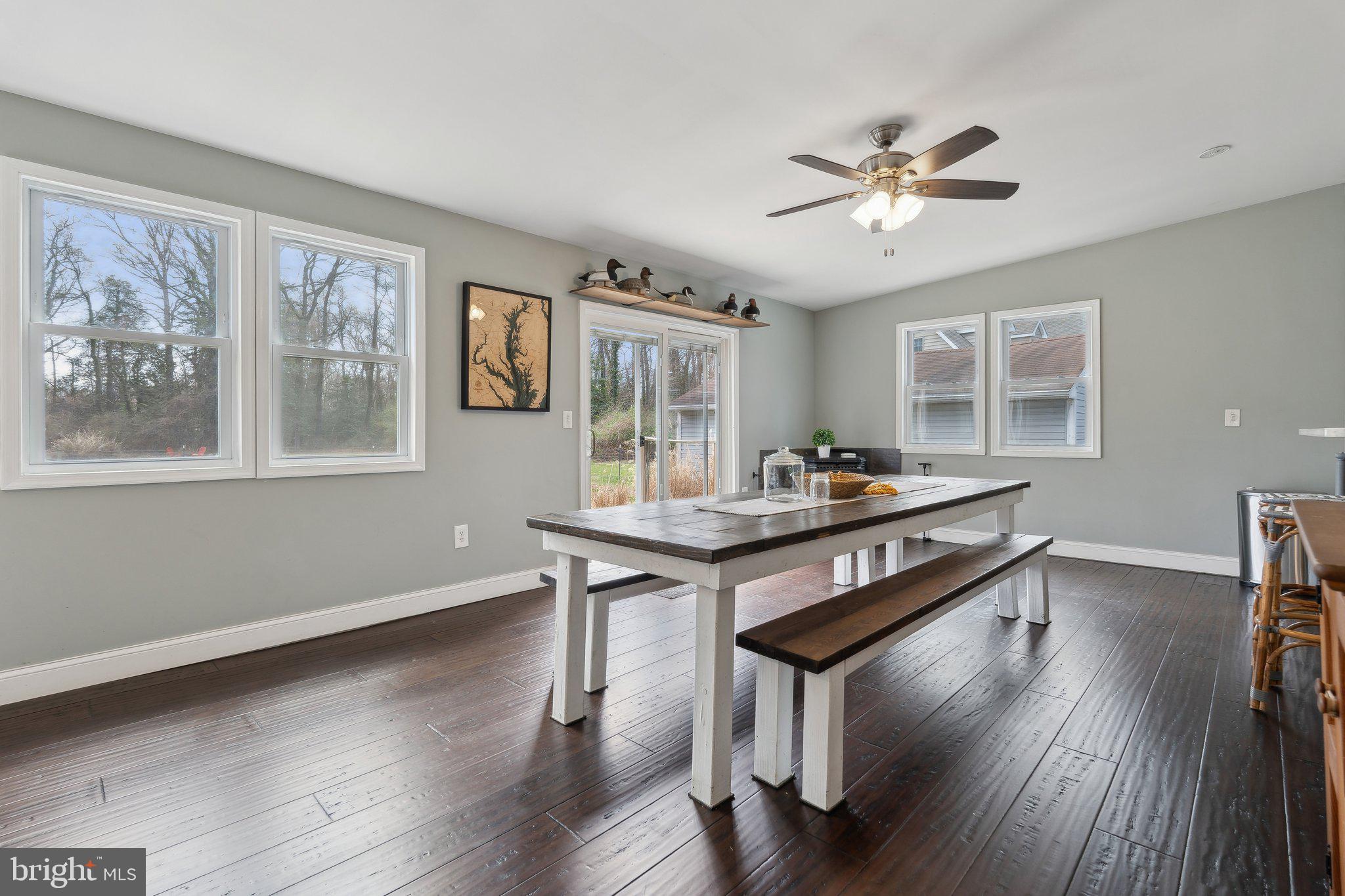 937 Winding Road Edgewater, MD 21037 - Photo 8 of 42 a view of a workspace with furniture window and wooden floor