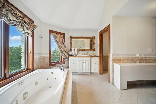 a view of utility room and bathroom