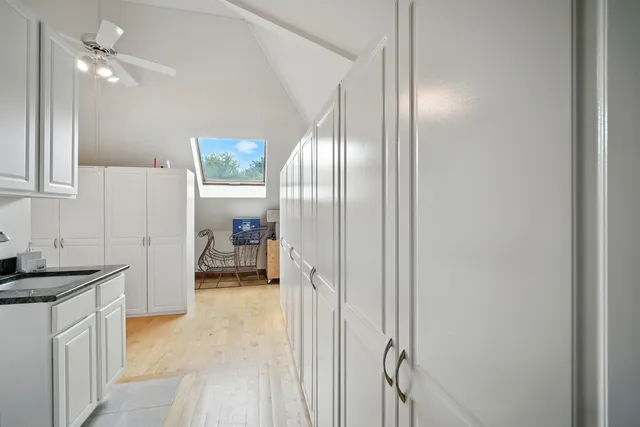 a kitchen with a refrigerator and a sink