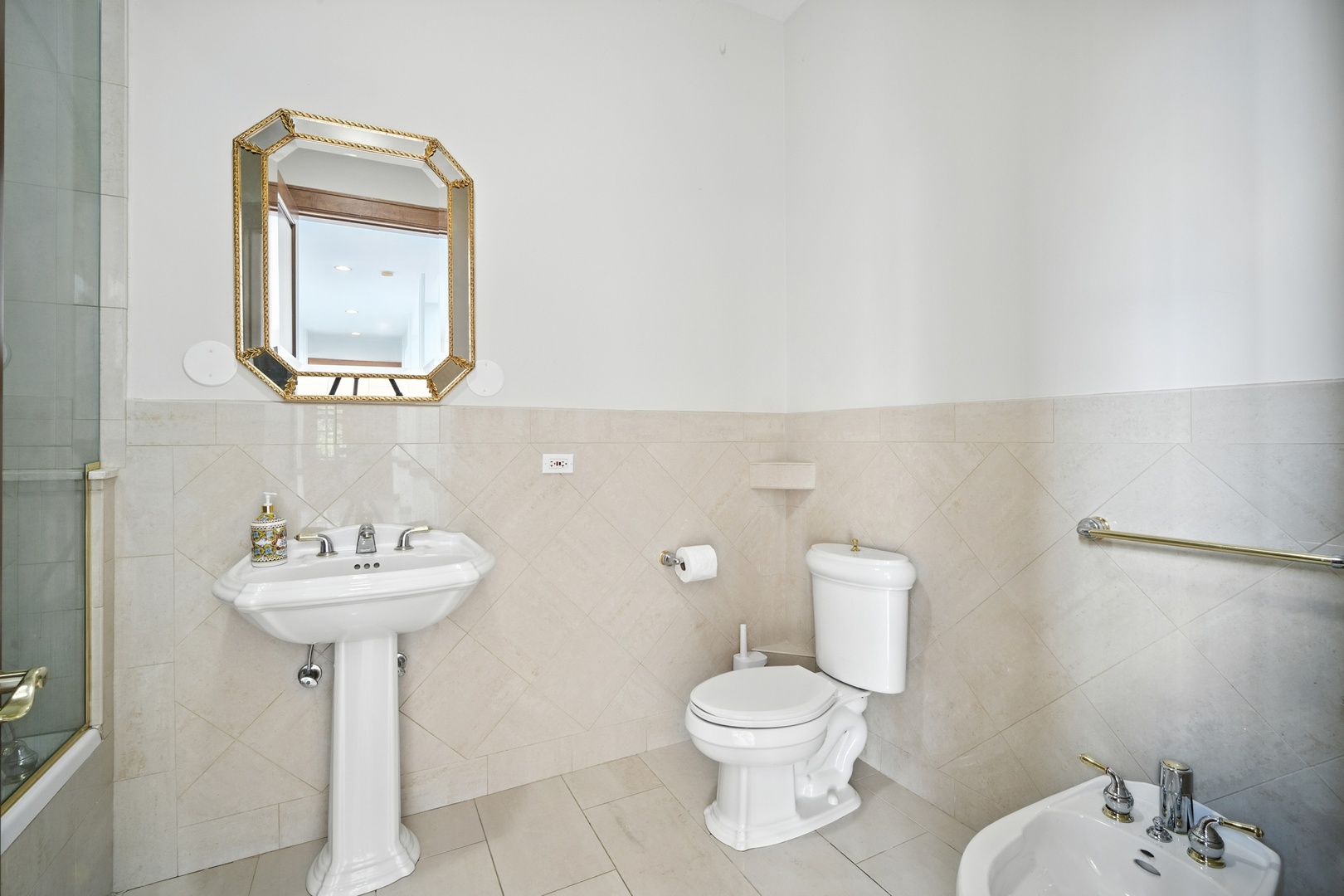 1100 MacAlpin Drive Inverness, IL 60010 - Photo 26 of 50 a bathroom with a sink a mirror and a toilet
