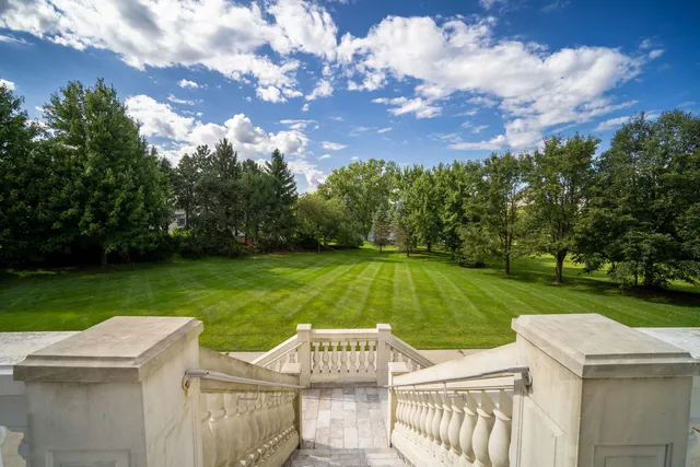 a view of a garden and swimming pool