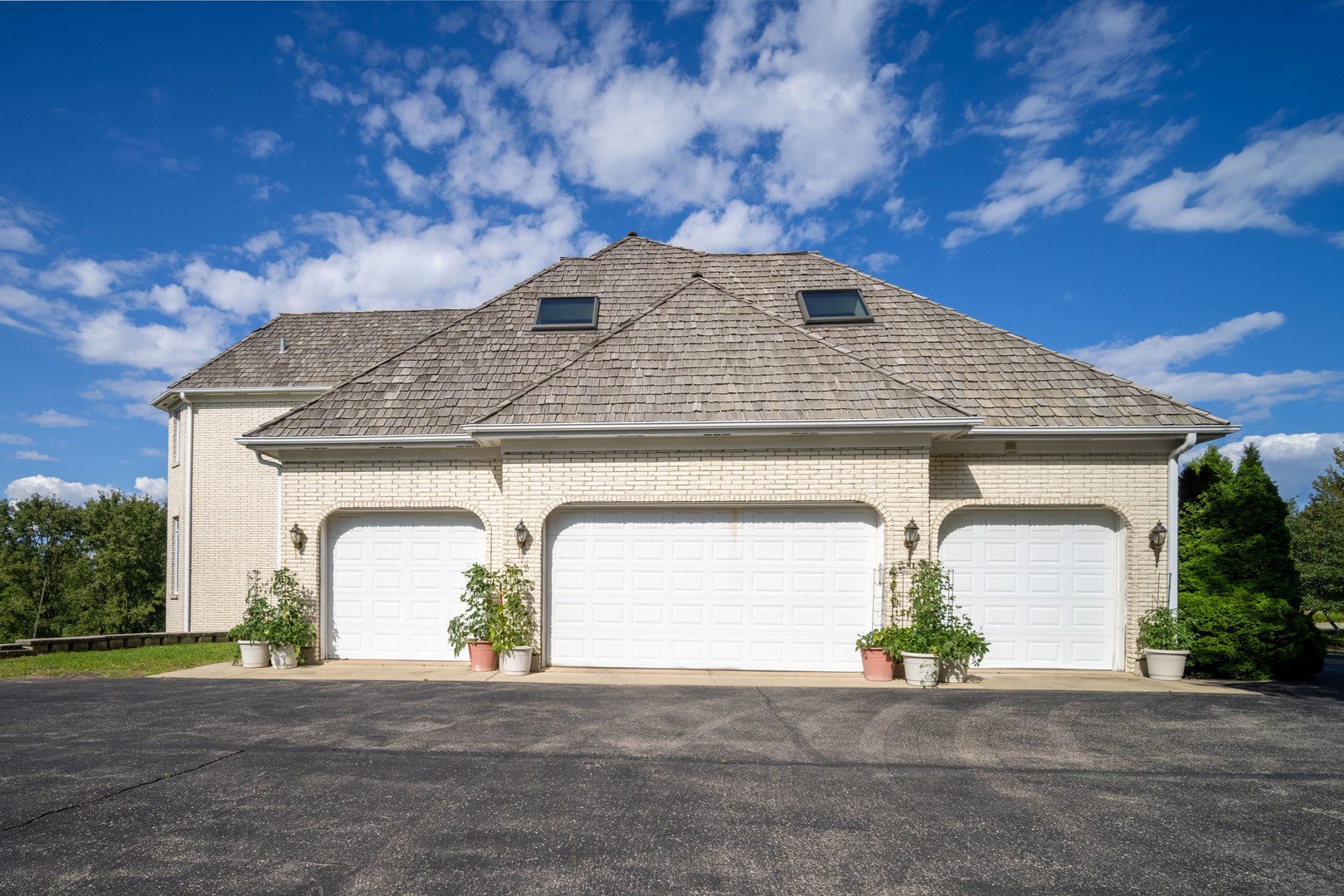 1100 MacAlpin Drive Inverness, IL 60010 - Photo 40 of 50 a front view of a house with a yard and garage