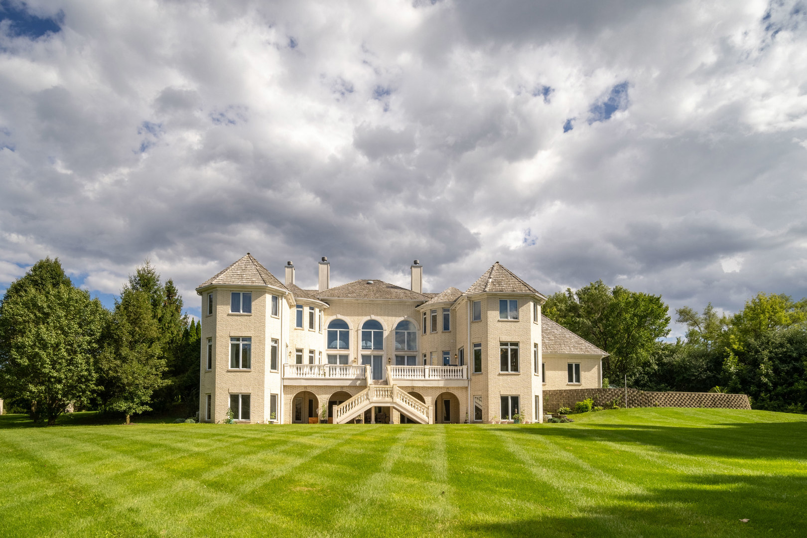 1100 MacAlpin Drive Inverness, IL 60010 - Photo 41 of 50 a front view of a house with a garden and trees