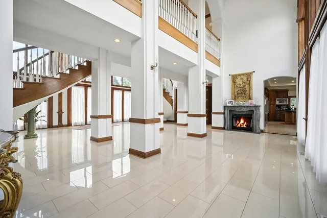 a view of living room with furniture and fireplace