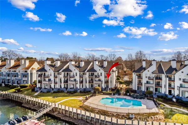 a view of a swimming pool with sitting area