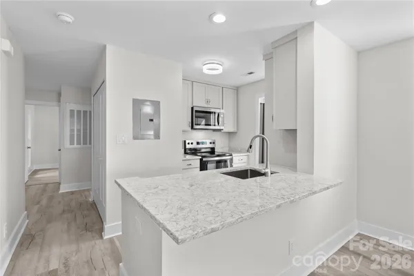 a kitchen with a dining table and chairs in it