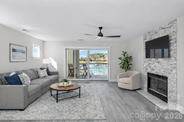 a view of a livingroom with furniture and a fireplace