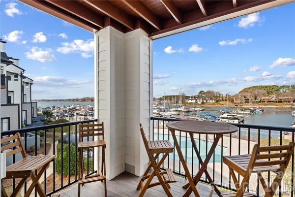 a view of a balcony with chairs
