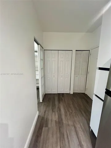 a view of entryway with wooden floor