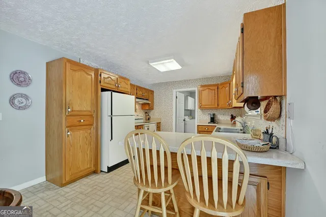 a bedroom with a bed and a table in it