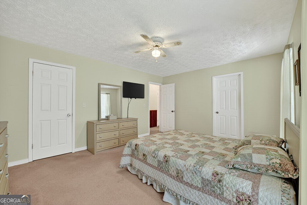 1362 Cherry Log Street Cherry Log, GA 30522 - Photo 20 of 55 a bedroom with a bed and a chandelier