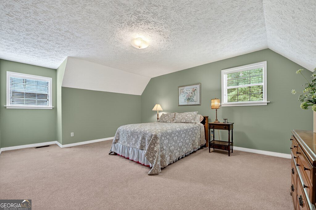 1362 Cherry Log Street Cherry Log, GA 30522 - Photo 23 of 55 a bedroom with a bed and a window