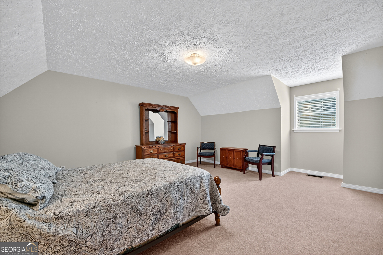 1362 Cherry Log Street Cherry Log, GA 30522 - Photo 26 of 55 a bedroom with a bed and a table in it with window
