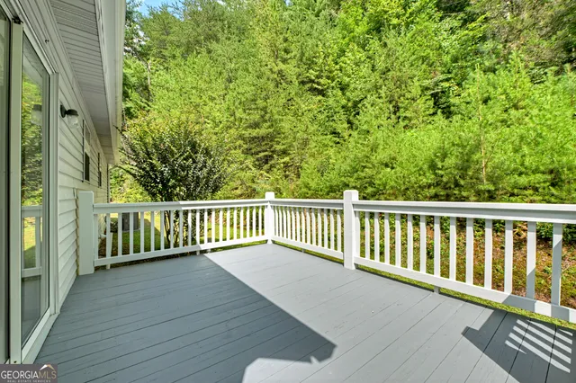 a view of a balcony with wooden floor