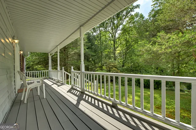 a view of balcony with deck and wooden floor