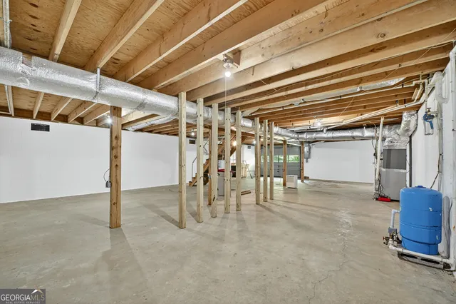 a view of empty room with wooden walls